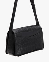 Croc-embossed leathered shoulder bag with flap closure.