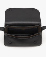 Open leather bag with visible compartments.
