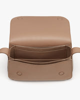 Open leather bag showing interior compartments.