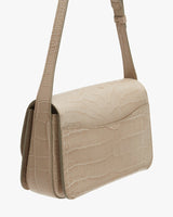 Shoulder bag with textured surface and adjustable strap.