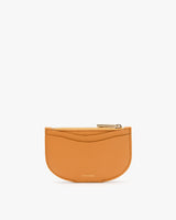 Small purse with zipper closure on plain background.