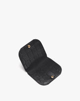 Open wallet with textured surface and snap buttons.