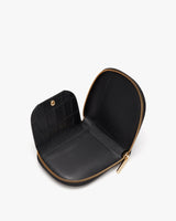 Open small wallet with a zipper on a plain background