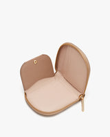 Open heart-shaped small purse with a zipper and interior compartment.