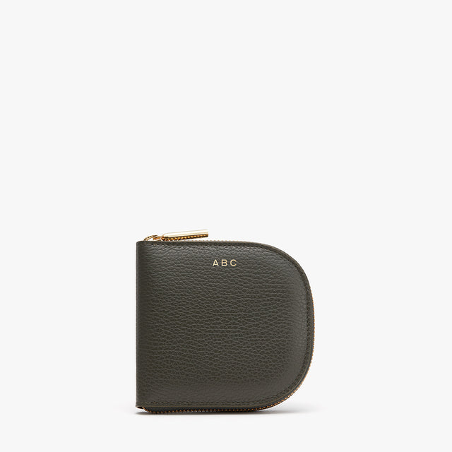 Small zippered wallet with initials 'ABC' embossed on it.