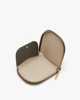 Open small zippered case with a rounded top.