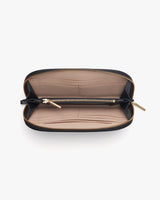 Open wallet with compartments and a zipper closure.