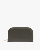 Zippered wallet standing upright against plain background