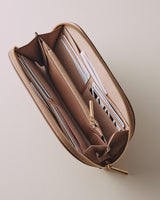 Open pencil case with various writing instruments inside.