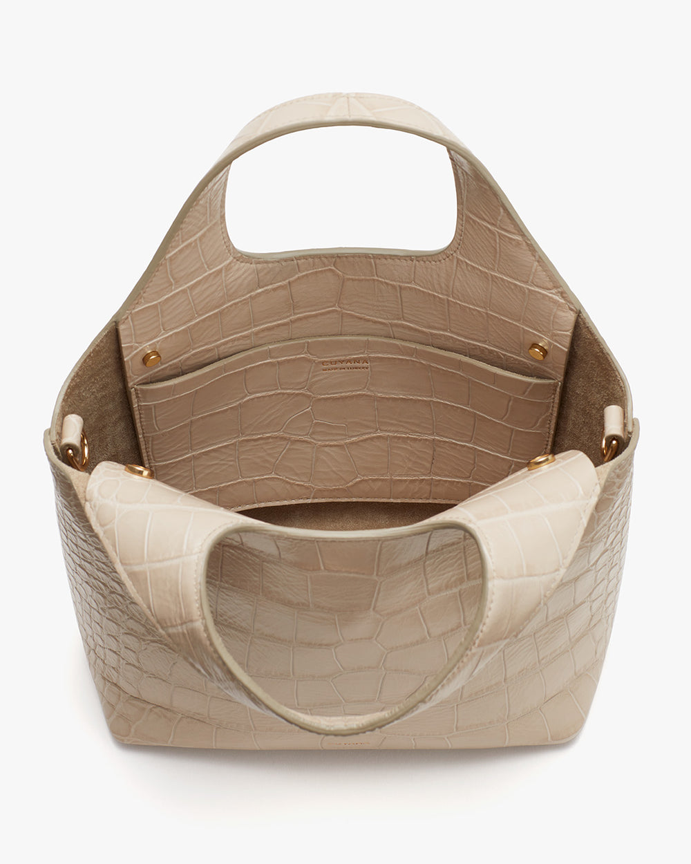Open top handbag with textured surface and rounded handles.