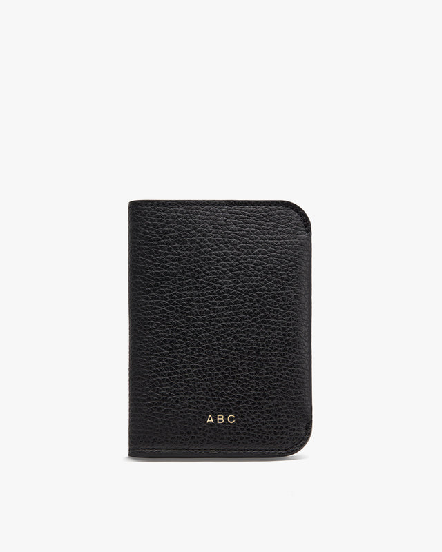 A textured wallet with the initials ABC on the lower front.