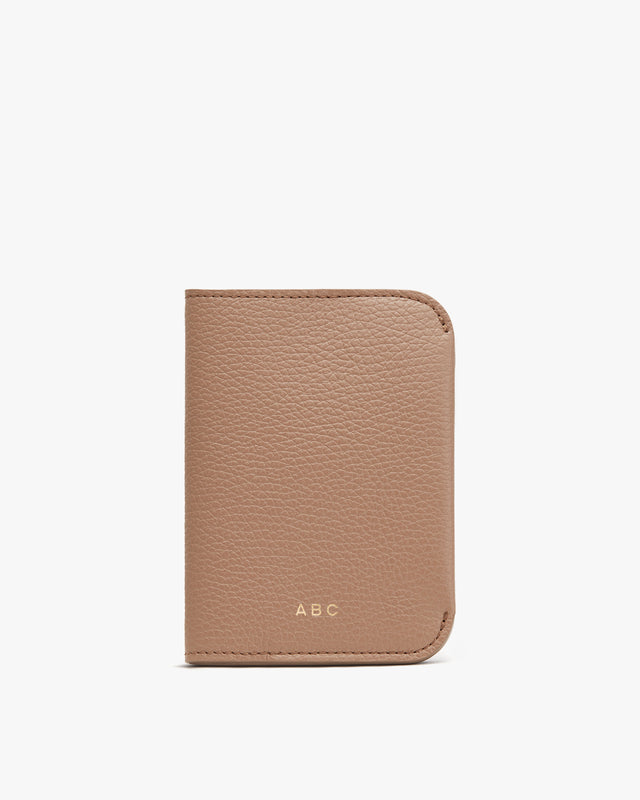 Wallet with initials ABC embossed on it.