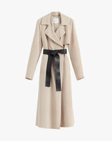 Trench coat with a belt on a white background