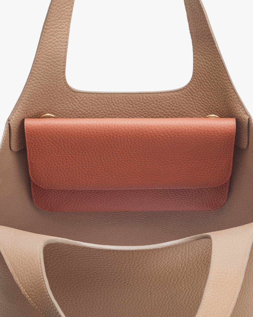Close-up view of a handbag with a top handle.