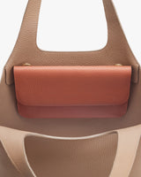 Close-up view of a handbag with a top handle.
