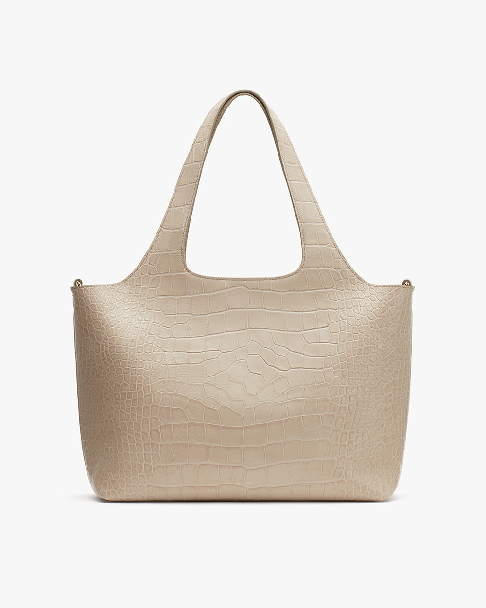 Handbag with two handles and textured surface.