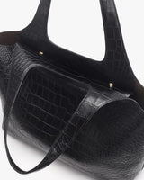 Handbag with croc-embossed leather and two straps.