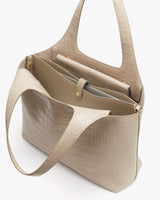 Open handbag with inner compartments and shoulder strap