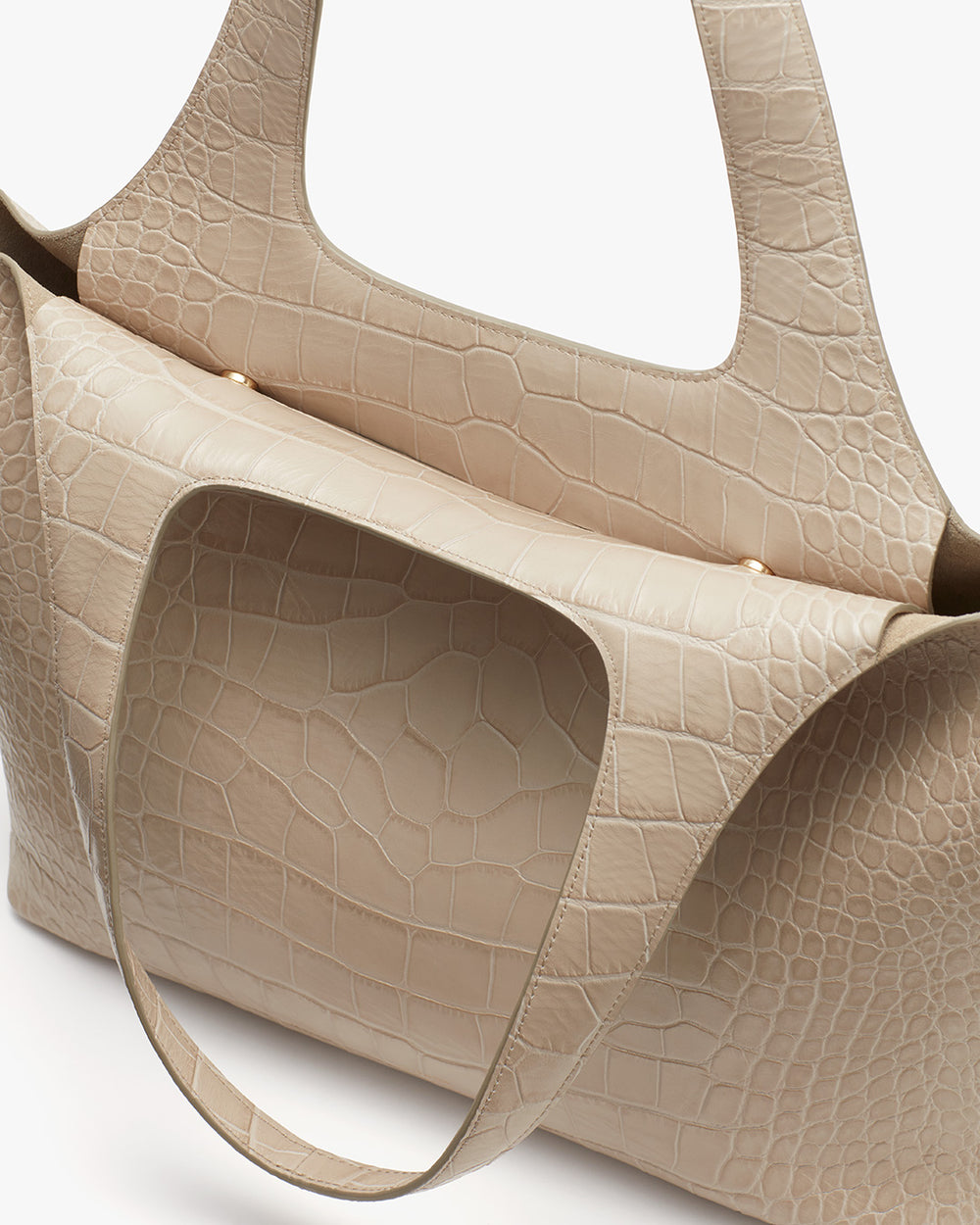 Two textured tote bags with top handles positioned next to each other.