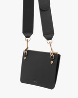Small handbag with shoulder strap and metal clasps.