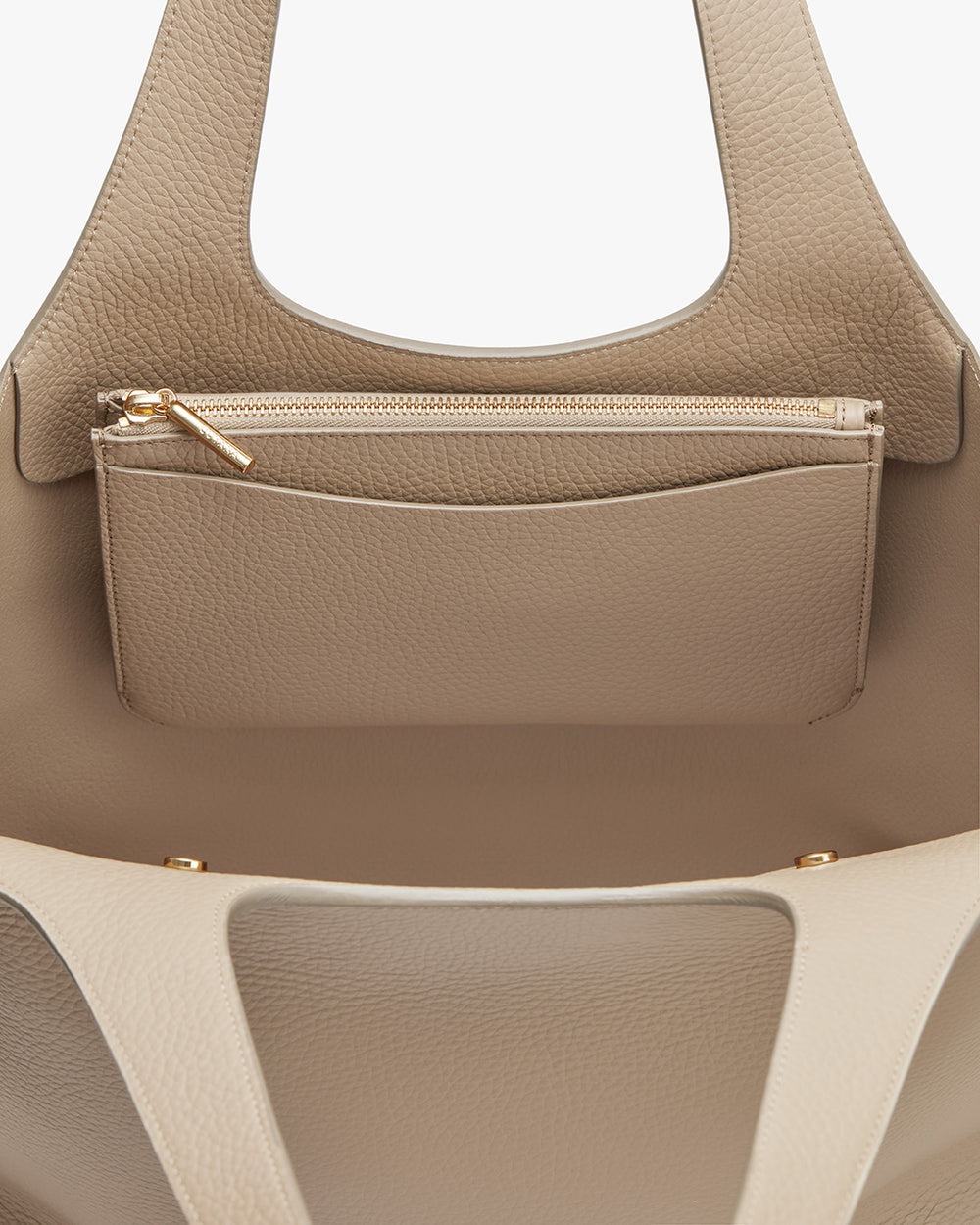Two beige handbags with handles, one featuring a zipper compartment.