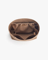 Open fabric storage container with gathered inner lining and side handles