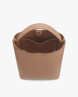 Open handbag with internal compartments visible.