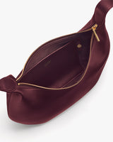 Shoulder bag with zipper and interior pocket.