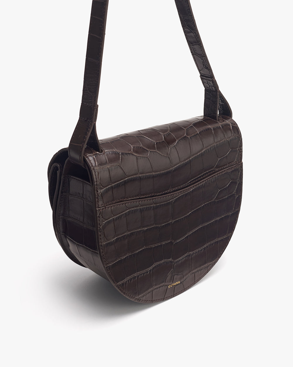 Double Moon Saddle Bag (Croco) Crossbody bag in croc-embossed leather with a flap closure and an adjustable strap.