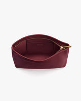 Open small pouch with a visible zipper and inner pocket.