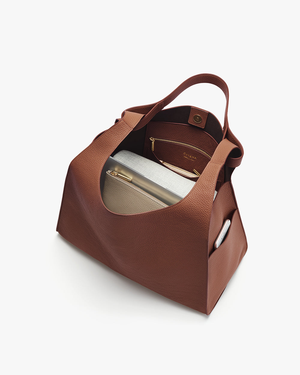 Oversized Double Loop Bag Open tote bag with items inside including a pouch and a tablet.