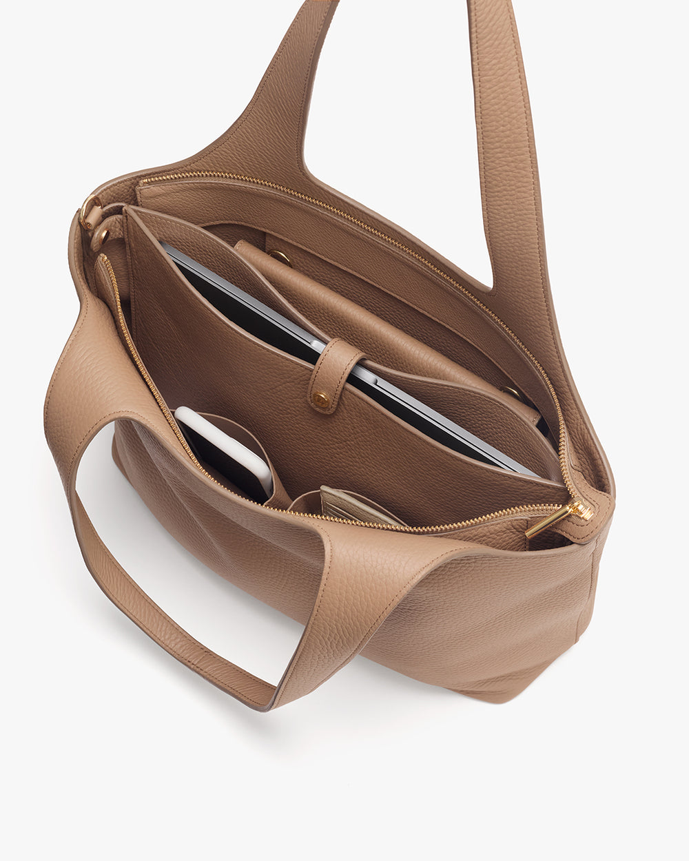 Open handbag with compartments showing a wallet, phone, and tablet inside