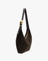 Shoulder bag with a curved shape and adjustable strap