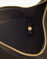 Open bag with gold zipper and inside pocket with button closure.