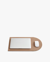 Laptop and mouse on a flattened laptop sleeve.