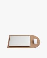 Laptop and mouse on a flattened laptop sleeve.