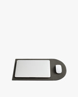 Laptop and mouse on a flattened laptop sleeve.