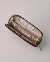 Open zippered wallet with card slots and pockets.