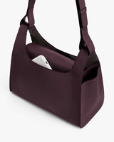 Shoulder bag with phone in outer pocket