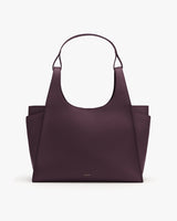 Tote bag with wide handle and open-top design.