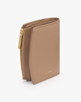 A compact wallet with multiple card slots and a zippered section.