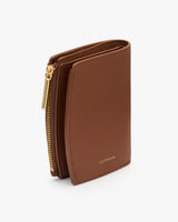 Folded wallet with zipper and small logo on front.