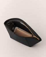 Open bag with a wallet and smartphone inside