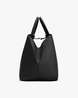 A structured tote bag with two handles and a unique closure.