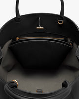 Open handbag with zippered inner pocket and handle straps.