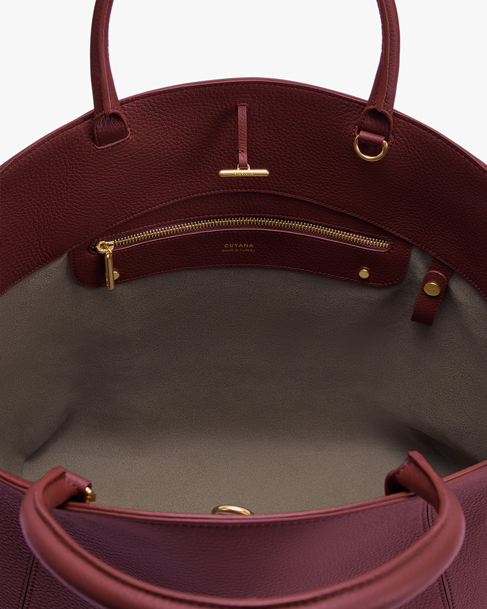 Forma Satchel Open handbag with visible interior zip pocket and handles.