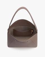 Open handbag with a small inner pouch and a strap