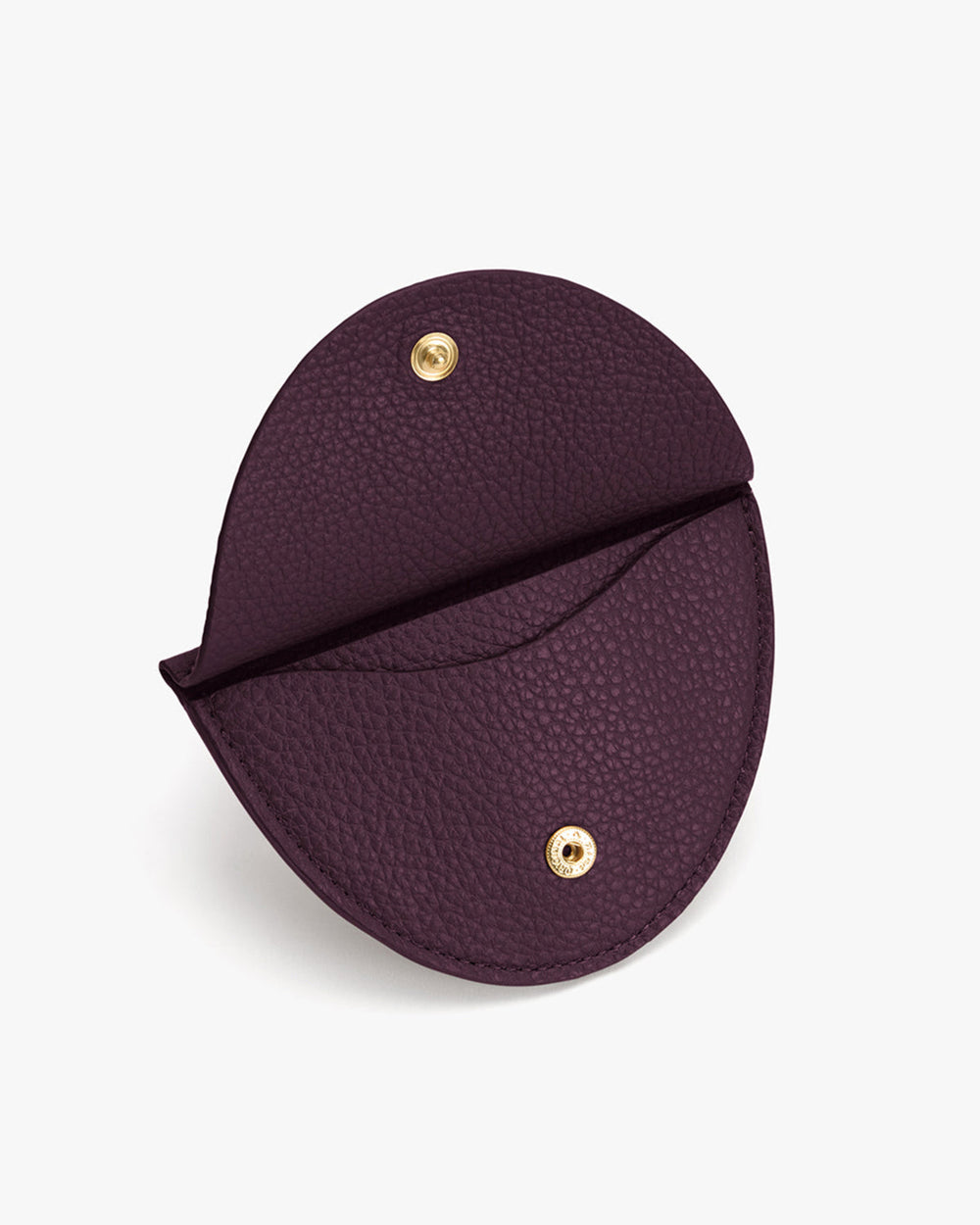 Large Jewelry Case Circular pouch with a button closure and textured surface.