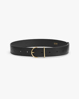 Leather belt with gold buckle on white background