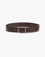 Leather belt with a gold buckle on a plain background